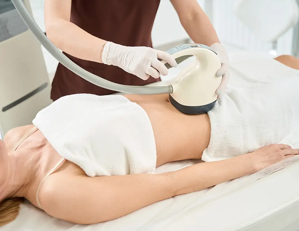 Woman receiving a stomach fat reduction treatment.