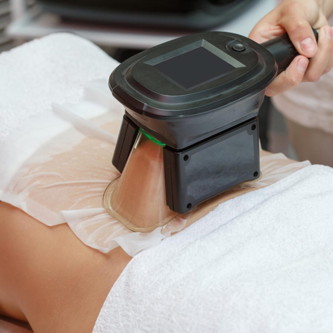 A person is getting their back examined by an ultrasound.